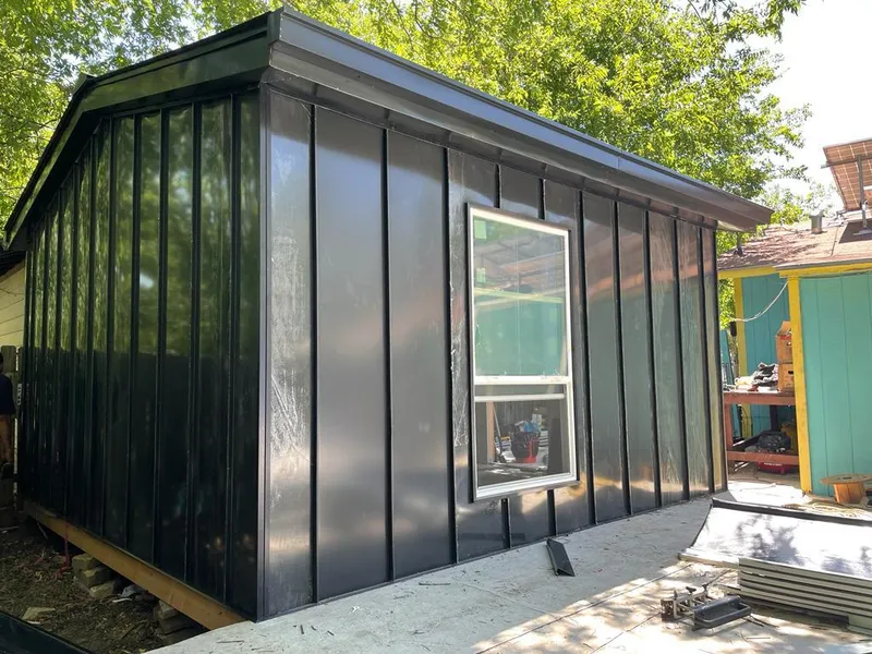 Black standing seam metal wall panels for Roof Inspection in Gladewater